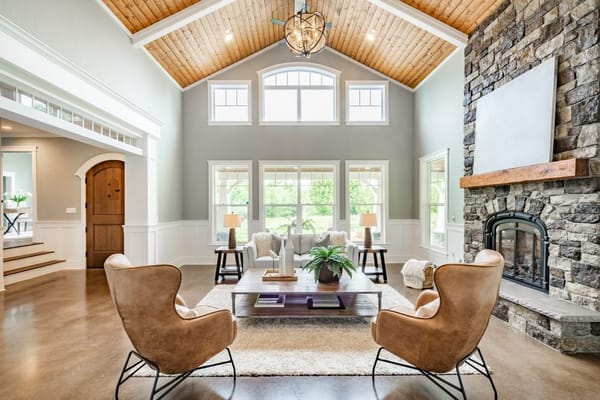 Living room interior with vaulted ceiling with wood cedar panelling